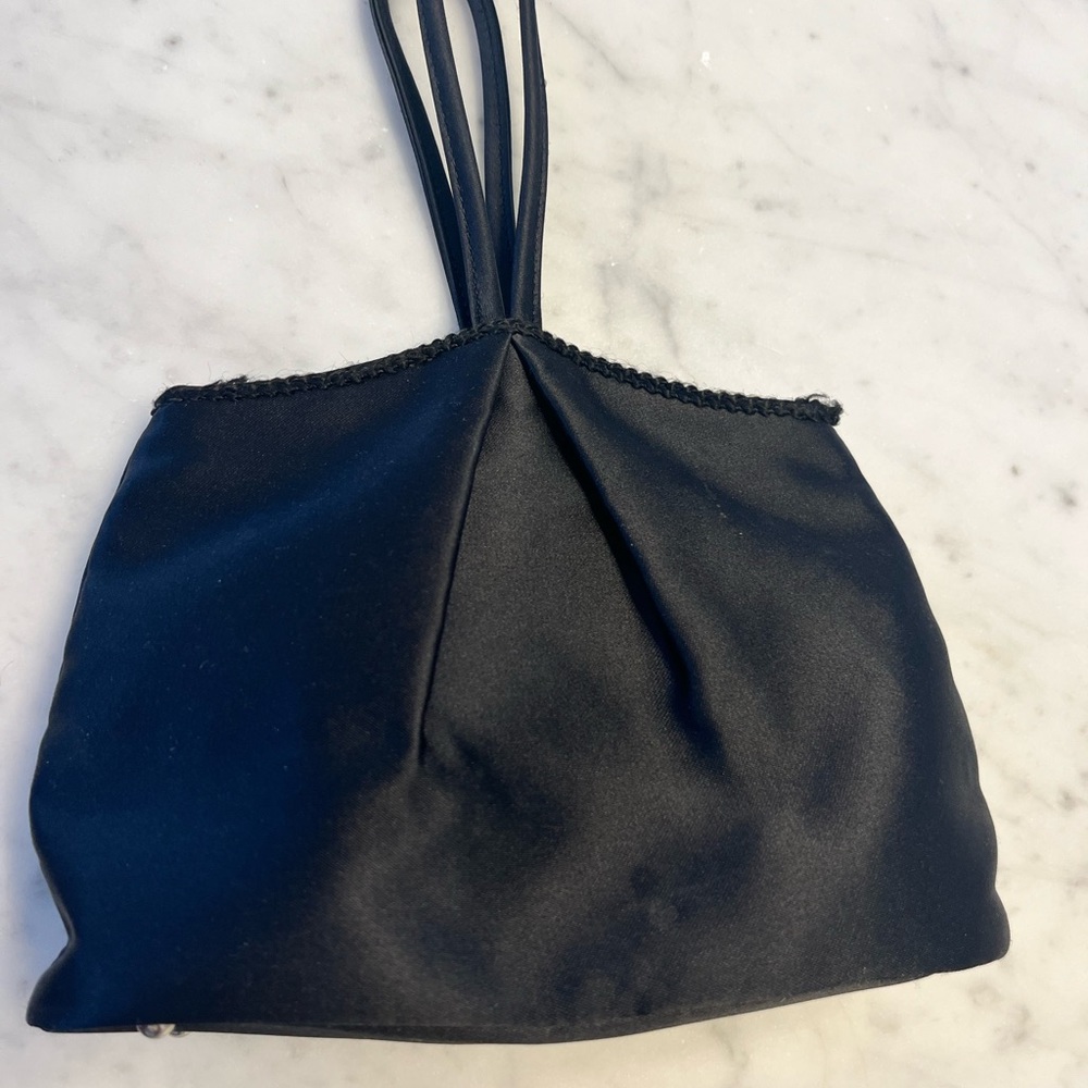 Ann Taylor Wristlet black satin bag with free mirror.